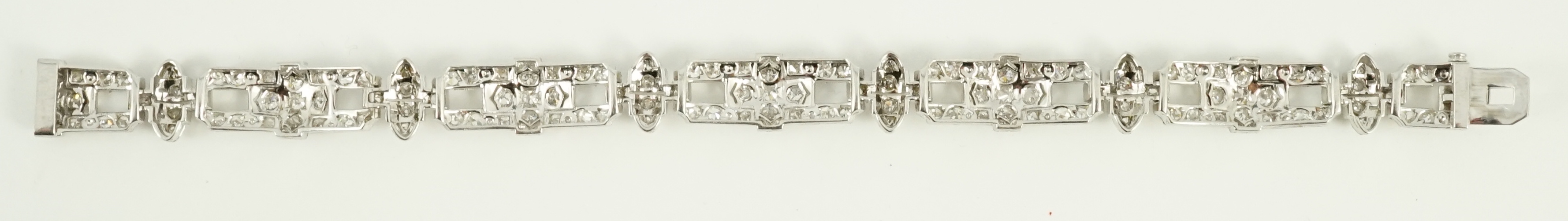 An Art Deco style pierced platinum and diamond cluster set bracelet